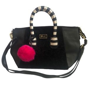 Betsey Johnson handbag with pink pompom.